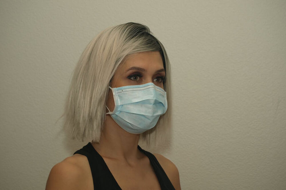 girl wearing three layer brilliance air face mask